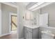 Modern bathroom with a vanity, toilet and access to a patio at 11332 Rivers Bluff Cir, Lakewood Ranch, FL 34202