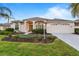 Beautiful home with a landscaped yard, two-car garage, and a welcoming front porch at 11332 Rivers Bluff Cir, Lakewood Ranch, FL 34202