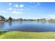 Stunning lake view with clear blue water and lush landscaping at 11332 Rivers Bluff Cir, Lakewood Ranch, FL 34202