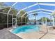 Relaxing kidney-shaped pool with screened enclosure and lake view at 11332 Rivers Bluff Cir, Lakewood Ranch, FL 34202