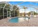 Inviting kidney-shaped pool with screened enclosure and lake view at 11332 Rivers Bluff Cir, Lakewood Ranch, FL 34202