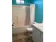Bathroom with teal walls and a shower/tub combo at 4601 Ulster Ave, North Port, FL 34287