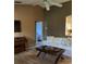 Bright living room with hardwood floors, white couch and coffee table at 4601 Ulster Ave, North Port, FL 34287