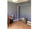 Well-lit bedroom with wood floors and ample closet space at 4601 Ulster Ave, North Port, FL 34287
