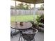 Screened patio with seating area and backyard view at 4601 Ulster Ave, North Port, FL 34287