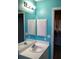 Clean bathroom with teal walls, double vanity, and tub at 4601 Ulster Ave, North Port, FL 34287