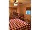 Bedroom with wood post bed and dresser at 4601 Ulster Ave, North Port, FL 34287
