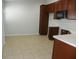 Kitchen with dark wood cabinets and tiled floor at 2086 Kings Palace Dr # 2086, Riverview, FL 33578