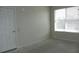 Empty bedroom with large window and door at 2086 Kings Palace Dr # 2086, Riverview, FL 33578