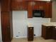 Kitchen with dark wood cabinets and microwave at 2086 Kings Palace Dr # 2086, Riverview, FL 33578