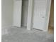 Empty bedroom with closet and door to another room; new flooring needed at 2086 Kings Palace Dr # 2086, Riverview, FL 33578