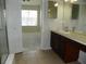 Bathroom with double vanity and view of bedroom at 2086 Kings Palace Dr # 2086, Riverview, FL 33578