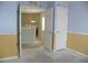 Open doorway to another room and a closet, light blue walls, and new flooring needed at 2086 Kings Palace Dr # 2086, Riverview, FL 33578
