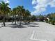 Gated community entrance with palm trees and brick pavers at 2086 Kings Palace Dr # 2086, Riverview, FL 33578