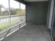 Screened lanai overlooking trees and road at 2086 Kings Palace Dr # 2086, Riverview, FL 33578