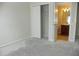 Bedroom with door to bathroom; new flooring needed at 2086 Kings Palace Dr # 2086, Riverview, FL 33578