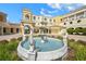 Grand entrance to the community with a beautiful fountain at 14041 Bellagio Way # 214, Osprey, FL 34229