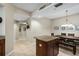 Kitchen island and dining area with wood finishes at 14041 Bellagio Way # 214, Osprey, FL 34229