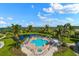 Resort-style pool with hot tub and scenic views at 14041 Bellagio Way # 214, Osprey, FL 34229