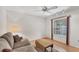 Bright living room featuring hardwood floors and a large window at 3905 Oakley Greene # 24, Sarasota, FL 34235