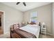 Well-lit bedroom with a double bed and ceiling fan at 2444 Vancouver Ln, North Port, FL 34286