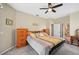 Main bedroom with king-size bed, dresser, and bathroom access at 2444 Vancouver Ln, North Port, FL 34286