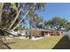 Backyard with a patio and seating area, ideal for outdoor gatherings with access to the screened in porch at 1841 Buccaneer Dr, Sarasota, FL 34231