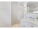 Bright bathroom featuring a white vanity, modern fixtures, and a stylish tiled walk-in shower at 1841 Buccaneer Dr, Sarasota, FL 34231
