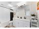 Updated bathroom with a double vanity, modern fixtures, and stylish shower with black and white accents at 1841 Buccaneer Dr, Sarasota, FL 34231
