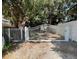 Gated property featuring a metal security gate at 1841 Buccaneer Dr, Sarasota, FL 34231