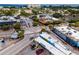 Aerial view capturing the vibrant street scene with restaurants and shops near Siesta Key Beach, with beachgoers at 1841 Buccaneer Dr, Sarasota, FL 34231
