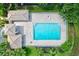 Overhead view of community pool with surrounding landscaping at 7341 Featherstone Blvd, Sarasota, FL 34238