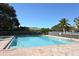 Inviting community pool with ample deck space for lounging at 7341 Featherstone Blvd, Sarasota, FL 34238