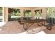 Relaxing covered picnic area with multiple tables and seating at 7341 Featherstone Blvd, Sarasota, FL 34238