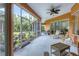 Relaxing screened patio overlooking backyard at 7341 Featherstone Blvd, Sarasota, FL 34238