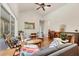 Relaxing living room with hardwood floors, high ceilings, and ample natural light at 7341 Featherstone Blvd, Sarasota, FL 34238