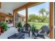 Tranquil screened patio with seating area and views at 7341 Featherstone Blvd, Sarasota, FL 34238