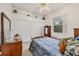 Cozy bedroom with double bed, built-in closet, and natural light at 7341 Featherstone Blvd, Sarasota, FL 34238