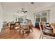 Spacious game room with wood floors, seating area, and game table at 7341 Featherstone Blvd, Sarasota, FL 34238