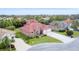 Two-story home in a residential neighborhood at 7341 Featherstone Blvd, Sarasota, FL 34238