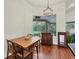 Charming dining area with hardwood floors and a view of the backyard at 7341 Featherstone Blvd, Sarasota, FL 34238