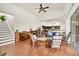 Spacious living area with hardwood floors, high ceilings, and views of the kitchen at 7341 Featherstone Blvd, Sarasota, FL 34238