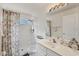 Simple bathroom with shower stall, vanity, and floral curtain at 7341 Featherstone Blvd, Sarasota, FL 34238