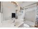 Clean bathroom with shower/tub combo, vanity, and window at 7341 Featherstone Blvd, Sarasota, FL 34238