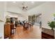 Open living room with hardwood floors, high ceilings, and access to the backyard at 7341 Featherstone Blvd, Sarasota, FL 34238