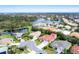 Community overview with lake and houses at 7341 Featherstone Blvd, Sarasota, FL 34238