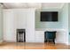 Home office with built-in cabinetry and hardwood floors at 8213 Midnight Pass Rd, Sarasota, FL 34242