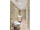 Guest bathroom with toilet and vanity, bird wallpaper at 8213 Midnight Pass Rd, Sarasota, FL 34242