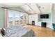 Main bedroom with water views, built-in cabinetry, and hardwood floors at 8213 Midnight Pass Rd, Sarasota, FL 34242