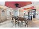 Bright dining area with large table and access to waterfront views at 8213 Midnight Pass Rd, Sarasota, FL 34242